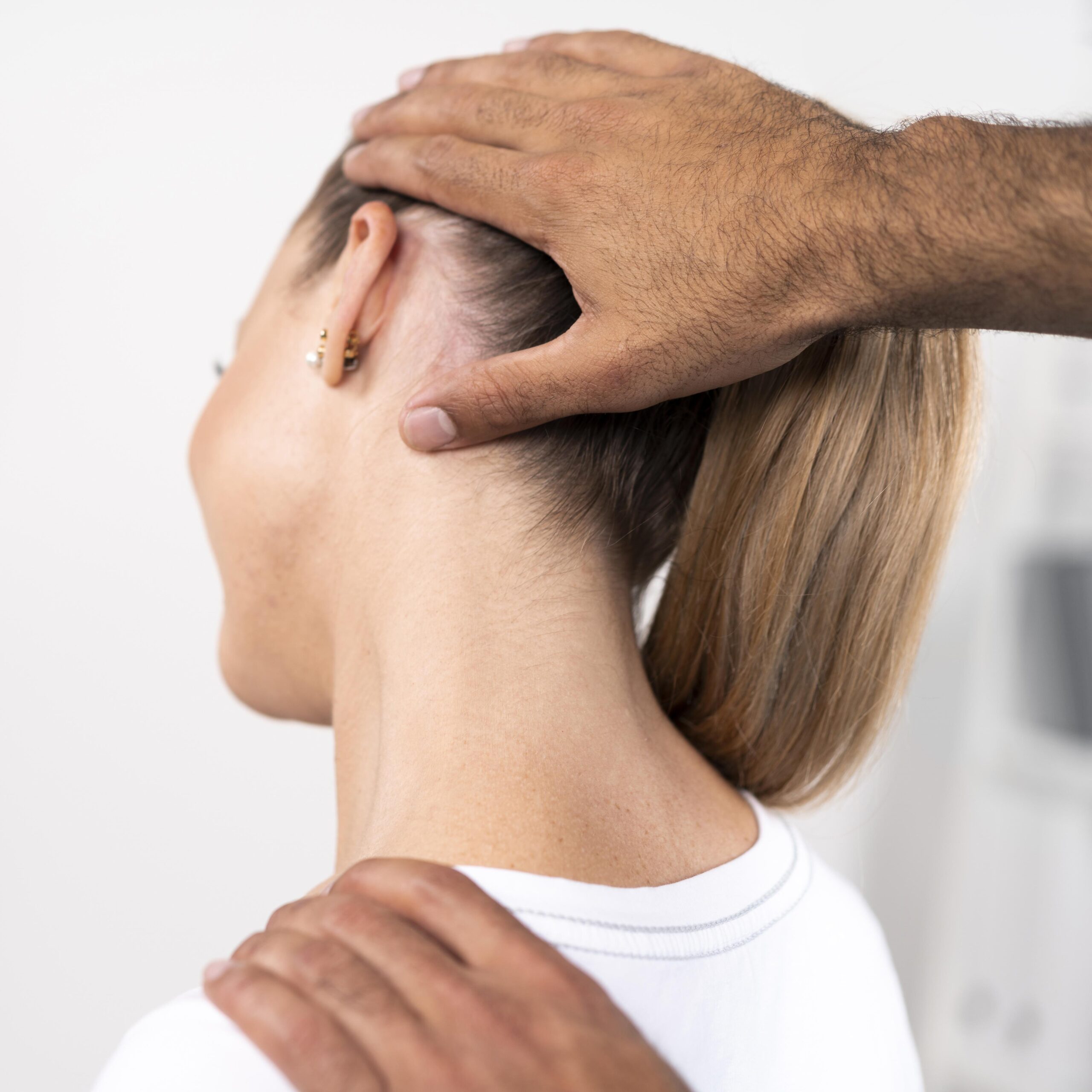 male-physiotherapist-checking-woman-s-neck